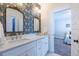 Stylish bathroom with dual vanities, and patterned wallpaper at 1753 Russell Se St, Atlanta, GA 30316
