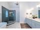 Elegant bathroom with a glass shower, double vanity, and modern fixtures at 1753 Russell Se St, Atlanta, GA 30316