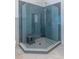 Modern bathroom featuring a tile shower with glass enclosure and gray tiled walls at 1753 Russell Se St, Atlanta, GA 30316