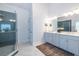 Modern bathroom featuring a glass shower, double vanity, and stylish decor at 1753 Russell Se St, Atlanta, GA 30316