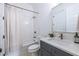 Cozy bathroom features gray cabinets and a shower with a decorative curtain at 1753 Russell Se St, Atlanta, GA 30316