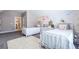 Bedroom with twin beds, decorative wallpaper, and white dresser at 1753 Russell Se St, Atlanta, GA 30316