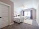 Charming bedroom with twin beds, floral wallpaper, and plush rug at 1753 Russell Se St, Atlanta, GA 30316