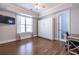 Bedroom with hardwood floors and a window with bright natural light and a ceiling fan at 1753 Russell Se St, Atlanta, GA 30316
