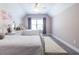 Bedroom featuring twin beds, a plush rug and window with violet drapes at 1753 Russell Se St, Atlanta, GA 30316