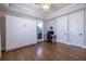 Bedroom with hardwood floors, a murphy bed, and a separate door leading to a private bathroom at 1753 Russell Se St, Atlanta, GA 30316