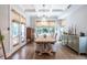 The dining room has an elegant chandelier, coffered ceilings, and natural light from the large windows at 1753 Russell Se St, Atlanta, GA 30316