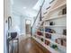 Welcoming foyer with hardwood floors, a staircase with built-in shelving, and stylish decor at 1753 Russell Se St, Atlanta, GA 30316