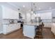 Bright eat-in kitchen with white cabinets, granite countertops, and stainless steel appliances at 1753 Russell Se St, Atlanta, GA 30316