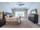 Spacious main bedroom with a tray ceiling, large window, and elegant furniture at 1753 Russell Se St, Atlanta, GA 30316