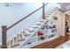 Charming staircase with built-in bookshelves for storage and display, plus hardwood floors at 1753 Russell Se St, Atlanta, GA 30316