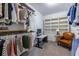 Spacious closet boasts a functional workspace and custom shelving for shoes and décor at 1753 Russell Se St, Atlanta, GA 30316