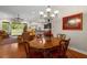 Traditional dining room featuring hardwood floors, neutral paint, chandelier, and access to an adjacent living room at 325 Ridge Hill Cir # 3, Marietta, GA 30064