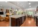 Open concept kitchen featuring hardwood floors, stainless appliances, granite countertops, and breakfast bar at 325 Ridge Hill Cir # 3, Marietta, GA 30064