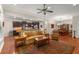 Open concept living room featuring hardwood floors, neutral paint, ceiling fan, and easy access to an adjacent kitchen and dining room at 325 Ridge Hill Cir # 3, Marietta, GA 30064