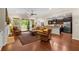 Open concept living room featuring hardwood floors, neutral paint, ceiling fan, and easy access to an outdoor patio at 325 Ridge Hill Cir # 3, Marietta, GA 30064
