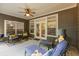 Relaxing patio area with seating, ceiling fan, and access to the backyard at 325 Ridge Hill Cir # 3, Marietta, GA 30064