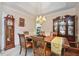 Elegant dining room with chandelier lighting and classic furnishings at 4440 Weston Sw Dr, Lilburn, GA 30047