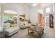 Spacious living room with high ceilings, neutral decor, and an open layout into the kitchen at 4440 Weston Sw Dr, Lilburn, GA 30047