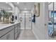 Modern bathroom with double sinks and a glass-enclosed shower, adjacent to a bedroom at 515 Regency Trl, Acworth, GA 30102