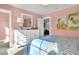 Inviting bedroom with pastel pink walls, comfy bed, and bright windows with picturesque views at 515 Regency Trl, Acworth, GA 30102