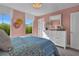 Sunlit bedroom with large windows, a comfortable bed, and cheerful pastel pink walls at 515 Regency Trl, Acworth, GA 30102