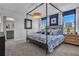 Serene main bedroom with four poster bed, calming color scheme, and natural light at 515 Regency Trl, Acworth, GA 30102