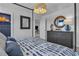 Beautiful main bedroom with canopy bed, striking light fixture, and lots of natural light at 515 Regency Trl, Acworth, GA 30102