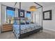 Comfortable main bedroom featuring a canopy bed, large windows, and serene decor at 515 Regency Trl, Acworth, GA 30102