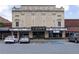 Exterior view of the Grand Theater showing its decorative facade, marquee, and surrounding parking area at 515 Regency Trl, Acworth, GA 30102
