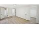Bright bedroom with hardwood floors, walk-in closet, and bathroom access at 6201 Davids Se Way, Acworth, GA 30102
