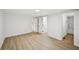 Room featuring two doorways and a bathroom, all with light-colored wood floors at 6201 Davids Se Way, Acworth, GA 30102