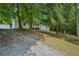 Exterior view of house with gravel base and some trees in the background at 6201 Davids Se Way, Acworth, GA 30102