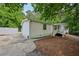 Exterior view of the house with concrete patio and white fence at 6201 Davids Se Way, Acworth, GA 30102