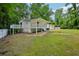 Exterior shot of the back of a house with a white fence surrounding the yard at 6201 Davids Se Way, Acworth, GA 30102