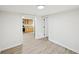 Bright hallway with a glimpse into the kitchen with stainless appliances and wood cabinets at 6201 Davids Se Way, Acworth, GA 30102