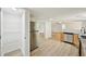 Bright kitchen adjacent to a pantry and featuring stainless steel appliances and a view of the living room at 6201 Davids Se Way, Acworth, GA 30102