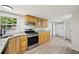 Spacious kitchen with stainless steel appliances, granite countertops, and access to the laundry room at 6201 Davids Se Way, Acworth, GA 30102