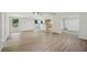 Bright, open-concept living room with light-colored wood flooring and modern track lighting at 6201 Davids Se Way, Acworth, GA 30102