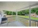 Back porch overlooking the lawn with a small storage shed at 6201 Davids Se Way, Acworth, GA 30102