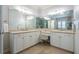 Bright bathroom with double vanity, large mirrors, and ample counter space provides a luxurious feel at 1075 Bluffhaven Way Northeast Ne Way, Atlanta, GA 30319