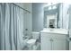 Bathroom with a shower and tub combo, white vanity, and white curtain at 1075 Bluffhaven Way Northeast Ne Way, Atlanta, GA 30319