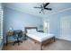 Cozy bedroom with light blue walls, carpet, and a ceiling fan at 1075 Bluffhaven Way Northeast Ne Way, Atlanta, GA 30319