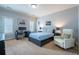 Bedroom with a blue bed, desk, and white upholstered chair at 1075 Bluffhaven Way Northeast Ne Way, Atlanta, GA 30319