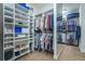 Walk-in closet with custom shelving and hanging racks for organized storage at 1075 Bluffhaven Way Northeast Ne Way, Atlanta, GA 30319