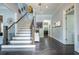 Elegant foyer boasts a staircase, hardwood floors, and plenty of natural light at 1075 Bluffhaven Way Northeast Ne Way, Atlanta, GA 30319