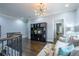 Sitting area with a view of the staircase and custom shelving unit at 1075 Bluffhaven Way Northeast Ne Way, Atlanta, GA 30319