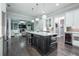 Spacious open concept kitchen with marble countertops, stainless steel appliances, and dark wood flooring at 1075 Bluffhaven Way Northeast Ne Way, Atlanta, GA 30319