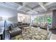 Bright open living room flows to patio, featuring coffered ceilings and hardwood floors at 1075 Bluffhaven Way Northeast Ne Way, Atlanta, GA 30319