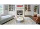 Living room with custom built-ins, fireplace, and hardwood floors at 1075 Bluffhaven Way Northeast Ne Way, Atlanta, GA 30319
